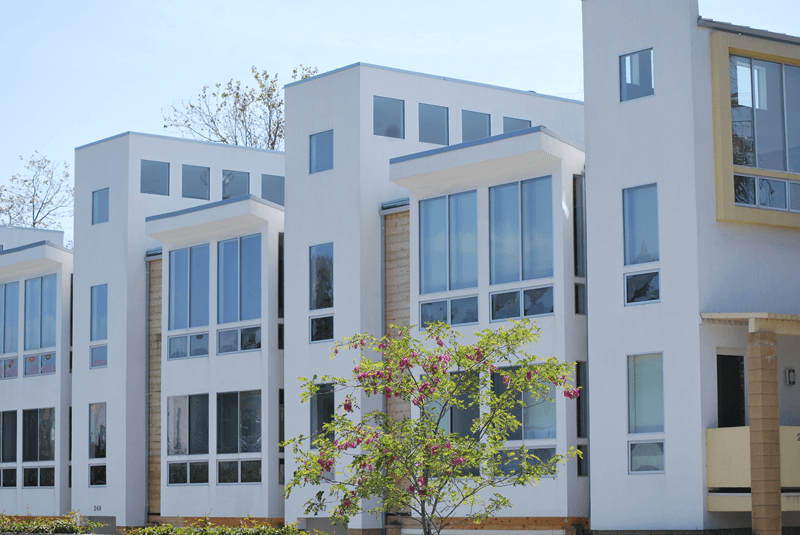 Exterior of large building with 2 story condos