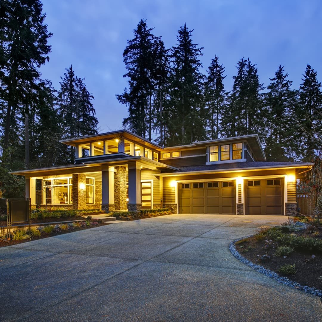 Mountain home lit at night